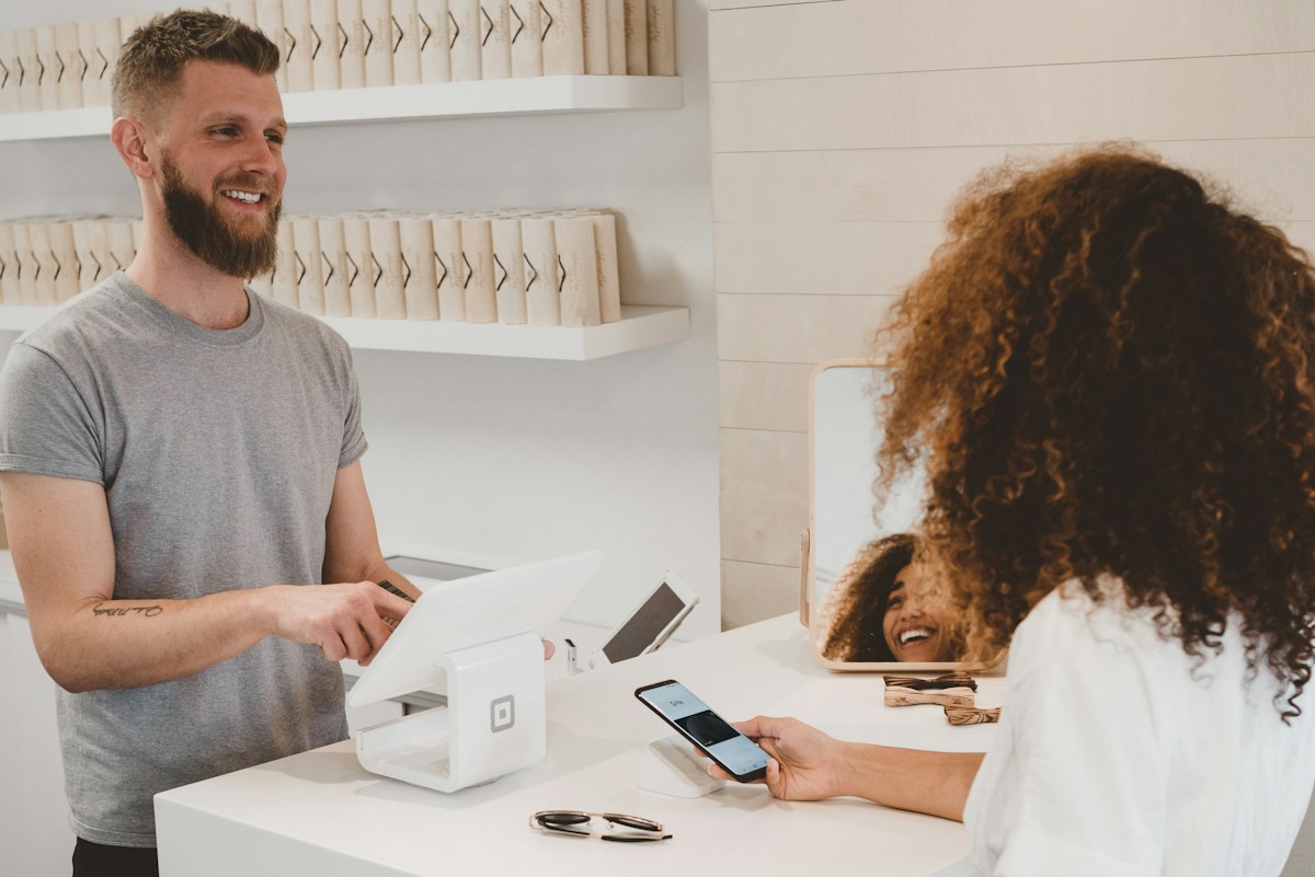 Shopping receipt and payment card representing sale price and discount calculations